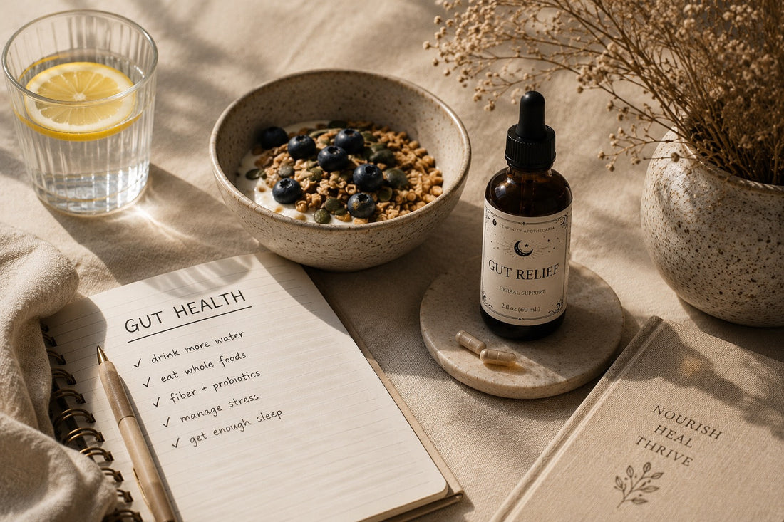 Gut health journal, Gut Relief tincture, blueberry granola bowl and lemon water styled on a linen surface